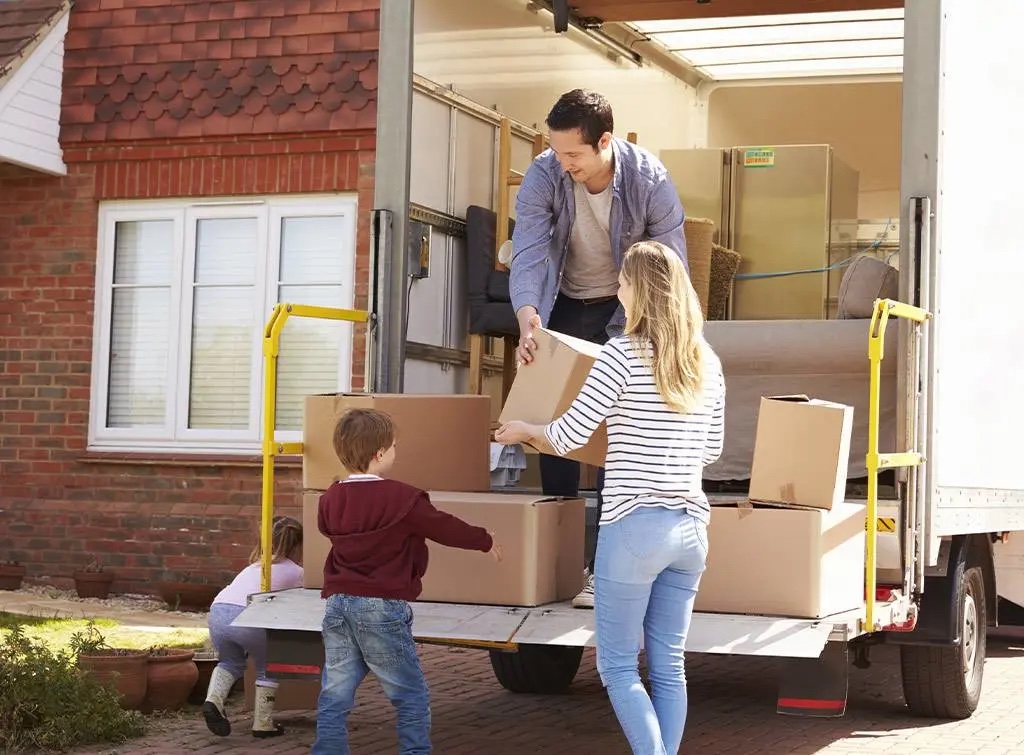 House removals in Bournemouth – movers loading boxes into a removal van as a family moves home.
