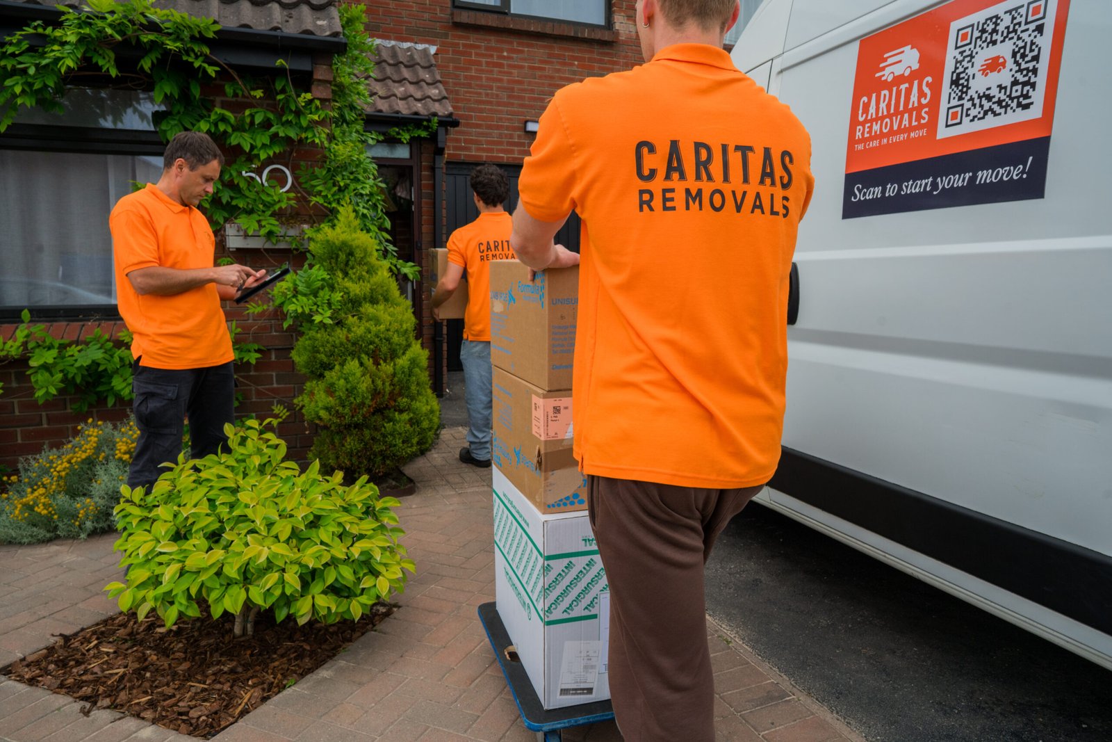 Caritas Removals team loading boxes into a van for a Man and Van move in Bournemouth