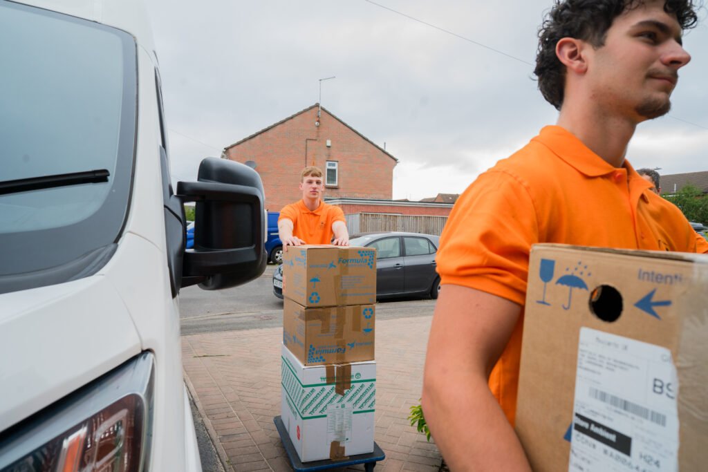 Caritas Removals team loading packed boxes into a removal van during a house move in Bournemouth
